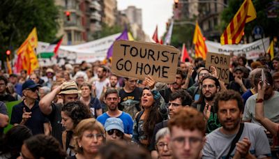 Barcelona protesters spray visitors with water: Why has Europe fallen out of love with tourism?