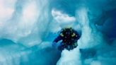 Photos show what cave divers discovered when they swam inside an iceberg the size of Jamaica. Today, it's gone.