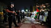 Dozens of arrests at UCLA as riot police storm protest after hundreds standoff against police