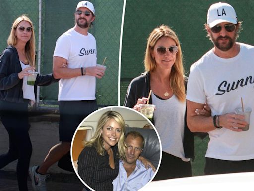 Kevin Costner’s ex-wife Christine Baumgartner holds onto boyfriend Josh Connor during romantic outing