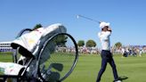 Novak Djokovic takes his tennis racket onto the 1st tee of golf's Ryder Cup All-Star match