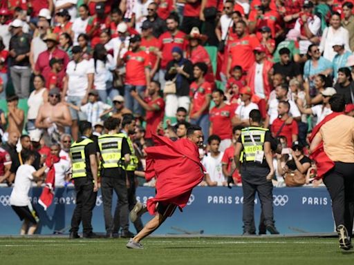 Olympic soccer gets off to violent and chaotic start as Morocco fans rush the field vs Argentina