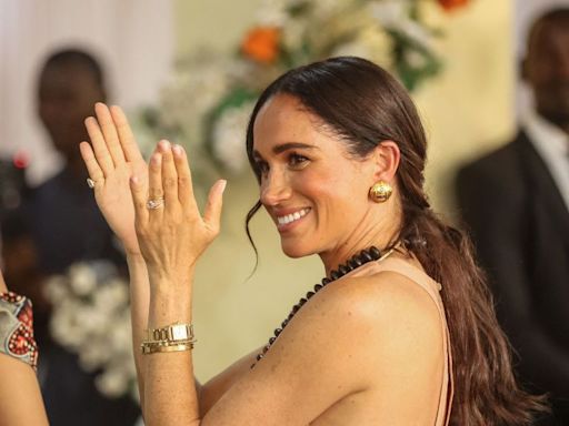 Meghan Markle Opted for a Pale Pink Maxi Dress on Day 1 of Her Trip to Nigeria
