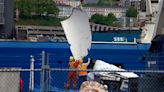 Debris from implosion of Titanic-bound submersible is returned to land