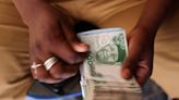 Nigeria's naira gains on spot market after central bank rate hike