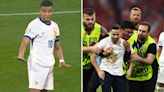 Major security breach as pitch invader pulled away from Mbappe during Spain game