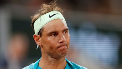 French Open day two: Rafael Nadal makes early exit but Iga Swiatek progresses