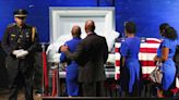 Dallas police officer who was fatally shot remembered as 'hero' during funeral service