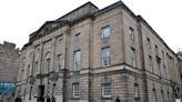 Paisley woman jailed after putting "lives in danger" by dragging mattress to flat door and setting it on fire