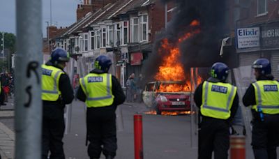 Which countries have issued travel warnings to citizens over UK riots?