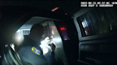 Video released of San Diego police officer locked in backseat with woman he was transporting