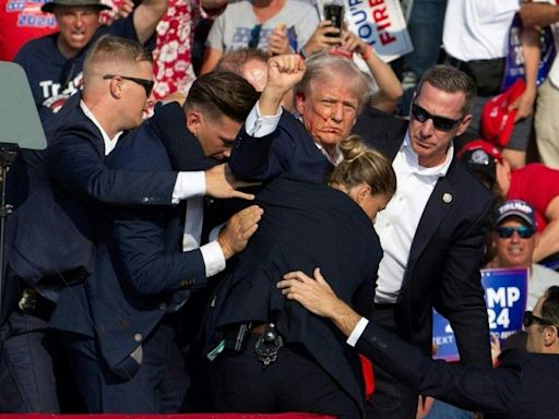 Donald Trump evacuated from stage after shooting at rally, Biden says ‘no place for this kind of violence’