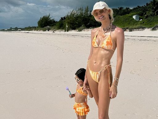 Devon Windsor showcases fit form at beach with 'mini me' daughter Enzo