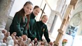 Girl, 11, joins hundreds of pupils making clay sculptures