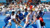 Olympics-Hockey-Britain, Argentina and Aussies into men's last eight, British and Spanish women through