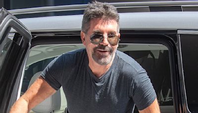 Simon Cowell looks on fine form he arrives for his boyband auditions