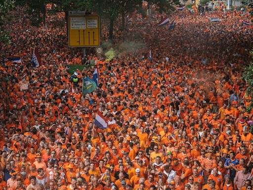 Pounding music, thudding bodies, flares and fun - on the march with the orange army