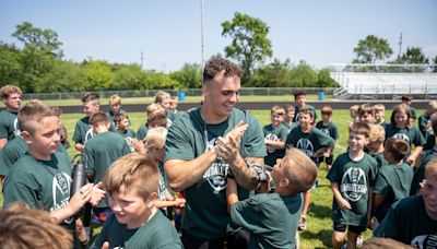 A full-circle moment: NFL linebacker hosts youth football camp at high school alma mater