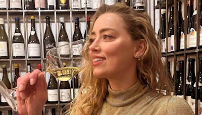 Amber Heard Smiles and Sips Champagne in Rare Photo to Celebrate Her 38th Birthday