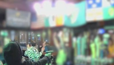 Armed thieves on the run after robbing popular West Side bar, video shows