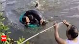 Upset with wife, man drives car into lake with three kids near Hyderabad | Hyderabad News - Times of India