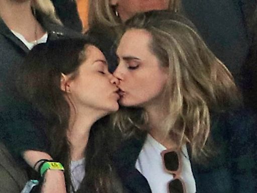 Cara Delevingne shares a passionate smooch with girlfriend Minke