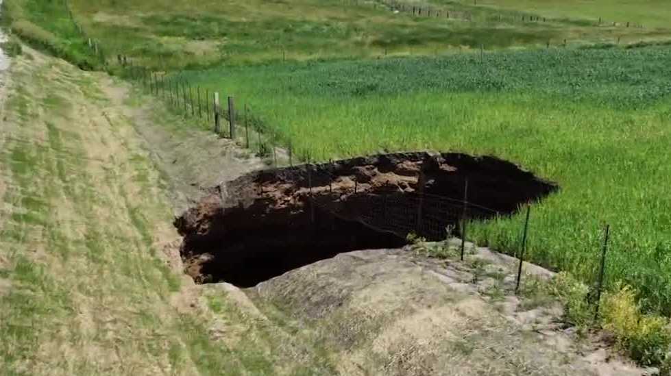 What caused the 40-foot wide sinkhole in Marion County to reappear?