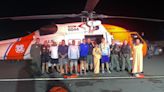 Coast Guard aircrew rescues 8 after boat capsizes