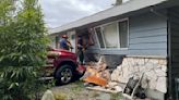 Driver injured after truck crashes into Edmonds home