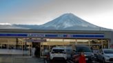 A Japanese town will erect a large mesh barrier to stop negligent foreign tourists from taking photos of Mount Fuji