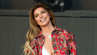 Shania Twain wows crowds in tweed mini skirt paired with sparkling white boots as she battles illness