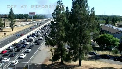 Freeway briefly shuts down in Sacramento as firefighters battle grass fire on American River