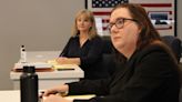 Cobb County Commission candidate Alicia Adams watches as her attorney argues against her disqualification in a hearing over the residency challenge brought by Mindy Seger on Friday, March 15, 2024, in Marietta.