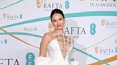 Lily James’s White BAFTAs Gown Featured an Ultra-Plunging Neckline and an Oversized Bow