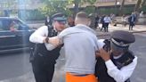 Police detain man after Just Stop Oil activist shoved to ground on Blackfriars Bridge
