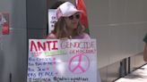 Peaceful demonstrators take a stand outside Prime Osborn Center during vice president’s visit