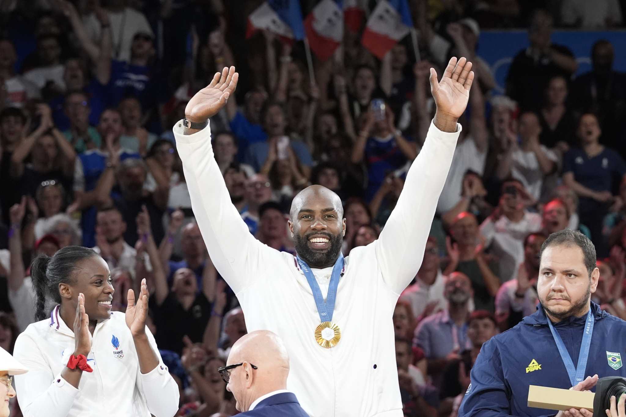 Teddy Riner stars again as France defends its Olympic title in mixed team judo, beating Japan final