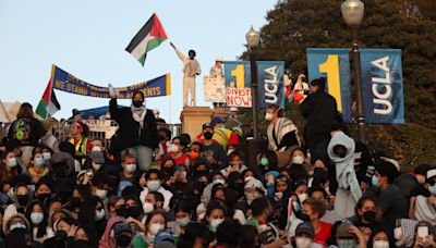 Large groups of protesters and officers in long standoff at UCLA