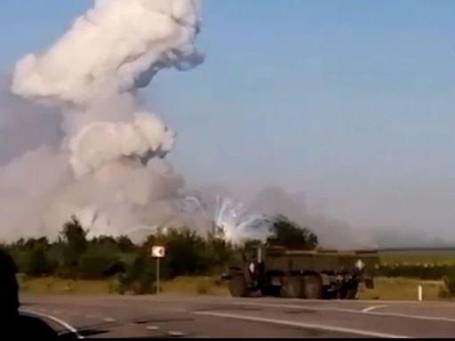 Russia vows to respond after Ukrainian drone attack sets on fire alleged munitions warehouse