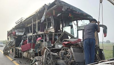 A double-decker bus collides with a milk truck in northern India, killing at least 18 people