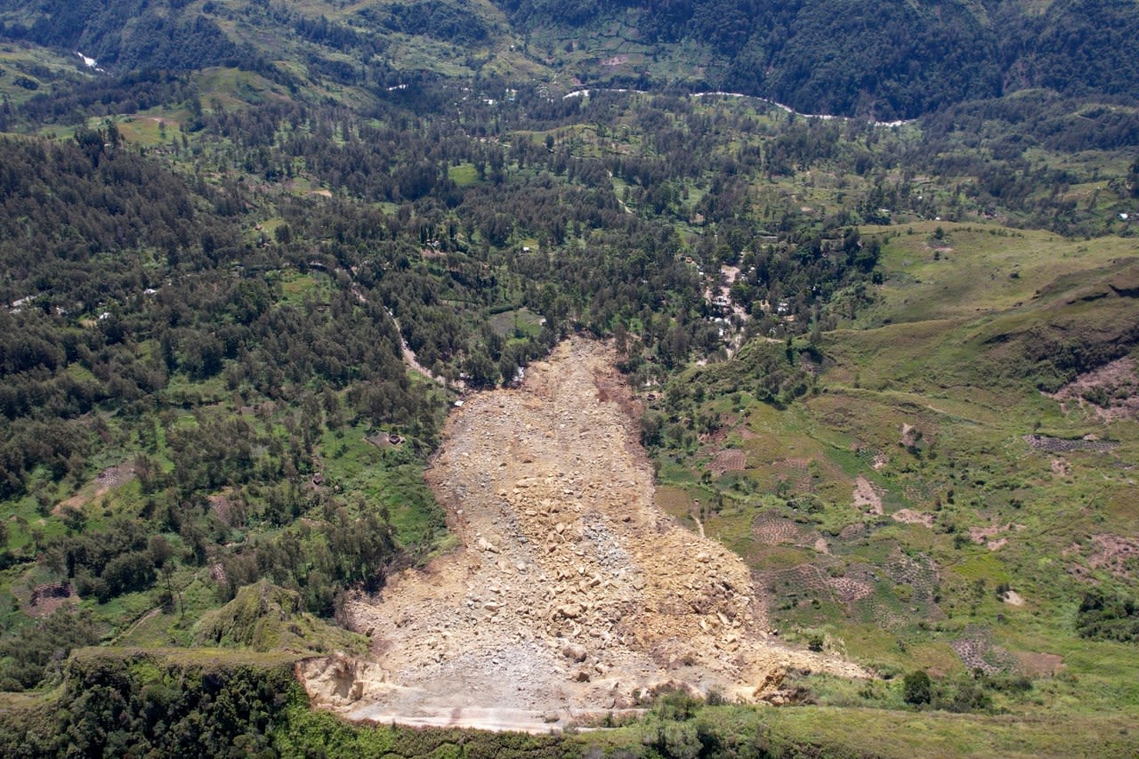 Papua New Guinea’s prime minister visits the site of a landslide estimated to have killed hundreds
