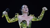 Katy Perry arrives at Paris fashion show wearing fur coat and ripped tights