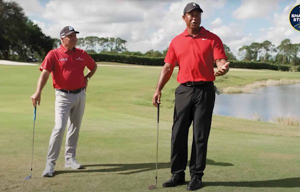 Tiger Woods shows Fred Couples how to hit his saucy draw chip