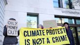 UK judge dismisses case against climate activist who held up sign outside trial