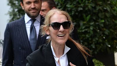 Celine Dion is in great spirits as she arrives in Paris for Olympics