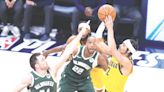 Indiana Pacers celebrate while sending Milwaukee Bucks packing to end their NBA playoff series Thursday