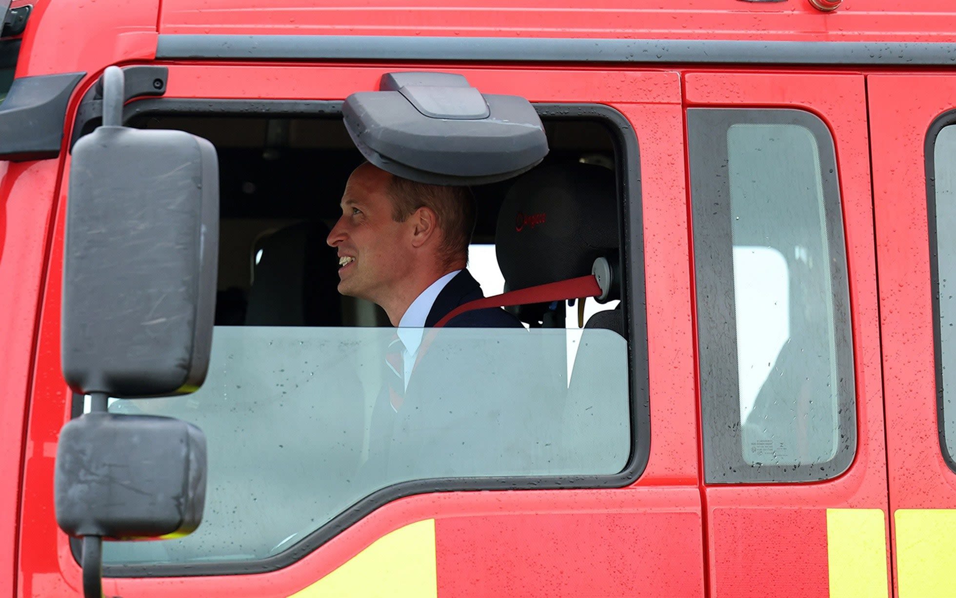Prince of Wales mans fire engine to put out blaze at his old RAF base
