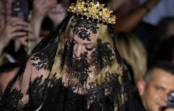 Madonna makes veiled entrance to Dolce&Gabbana for show celebrating her 1990s heyday