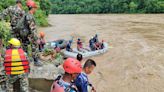 Dozens missing in Nepal after landslide triggered by heavy monsoon rain sweeps two buses into river