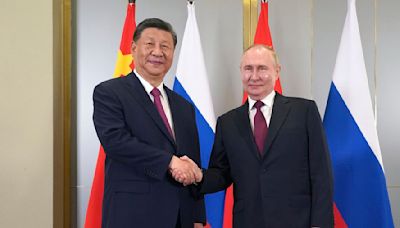Putin is reunited with his 'old friend' President Xi in Kazakhstan